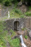 Waterfall running under abandoned road north of Bschlabs