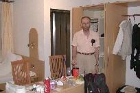 Tom (Paul) readies our purchased vegetables to supplement our meals