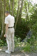 Examining brook near Ehrenberg in Italian Alps Examining brook near Ehrenberg in Italian Alps