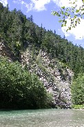 Swinging bridge across river in Italian Alps Swinging bridge across river in Italian Alps