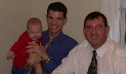 Maddie seems to have lost patience as she poses with Aaron and paternal grandfather, Howard Maddie seems to have lost patience as she poses with Aaron and paternal grandfather, Howard