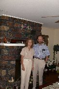 Kitty & Paul in living room of Kitty's teen year's home