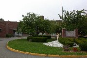 Kitty in front of her high school alma mater