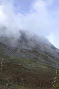 Blue sky patch above eroded hillside