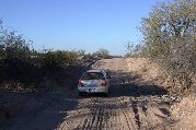 Our car climbs far side of wash Our car climbs far side of wash