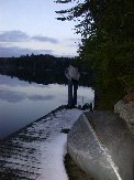Paul checks for bass at the end of the dock where water is the most shallow Paul checks for bass at the end of the dock where water is the most shallow