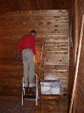 Paul removes door frame from closet in what has been middle bedroom