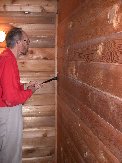 Paul finds a log that lets him wedge the wrecking bar in place