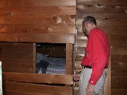 The south bedroom visible through the closet doorway