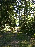 Little Straggle Lake seen at the end of a driveway