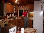 Paul removes the old open shelves prior to installing the modified corner cupboard