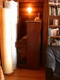 Piano is rolled out of the bedroom into the living room