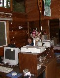 If one looks close, Kitty can be seen back there at her computer