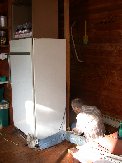 Moving the outlet for the fridge permitted a better fit in the corner