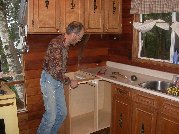 Blind corner cabinet is pushed into place