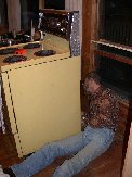 Paul works at reconnecting stove