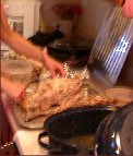Kitty&rsquo;s hands are a blur as she cleans off the turkey carcass