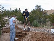 Large numbers of concrete blocks lay below the railroad tie and above the 3 pipes Large numbers of concrete blocks lay below the railroad tie and above the 3 pipes