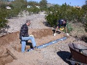 Getting the pipe under the railroad tie took some more dirt removal