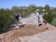 Back to the shovels and rake for filling in the open ditch containing the new culvert pipe
