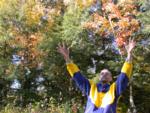 Paul throws milkweed pod contents into the air Paul throws milkweed pod contents into the air