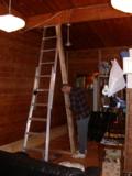 Locating the support post to rest on plank set over joist under wood flooring