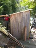 Measuring tape serves as plumb to show deviation from vertical