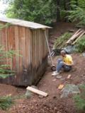Paul lowers the cabin onto the beam by lowering the jack