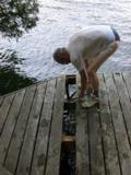 Wrecking bar being used to remove boards while minimizing damage to them