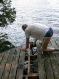 Loosening bolts keeping post in place vertically