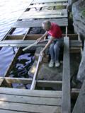 Paul levels the replacement beam currently tacked in place
