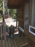 Paul inspects tongue and groove of first log removed