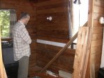 Paul considers details of last log installation