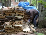 Paul stacks wood on newly added small pallet at inside corner