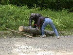 Kitty takes her turn at sawing to give Paul a rest