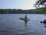 Kitty gives photo directions to Paul on shore